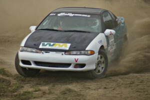 Adam Markut / Chris Gordon drift their Eagle Talon through the infield on SS1.