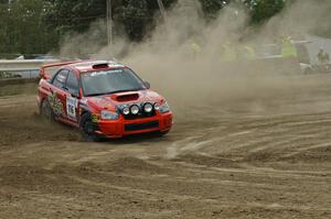 Nate Conley / Adam Kneipp set up nicely for a hairpin in their Subaru WRX STi on SS1.