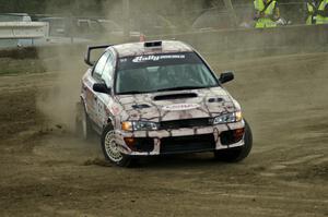 The Bob Olson / Conrad Ketelsen Subaru Impreza drifts hard through a hairpin on SS1.