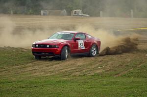 Mark Utecht / Rob Bohn sling dirt on SS1 in their Ford Mustang.