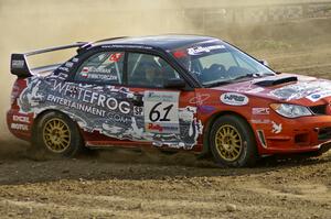 The Piotr Wiktorczyk / Grzegorz Dorman Subaru WRX STi powers through a corner on SS1.