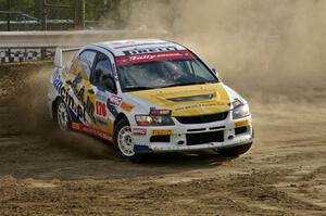 Andi Mancin / Maciej Wislawski throws his Mitsubishi Lancer Evo 9 sideways on a hairpin on SS1.