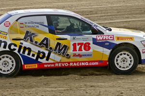 Andi Mancin / Maciej Wislawski Mitsubishi Lancer Evo 9 at speed on SS1.