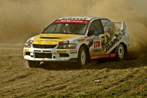 Andi Mancin / Maciej Wislawski throws his Mitsubishi Lancer Evo 9 sideways through infield sweeper on SS1.