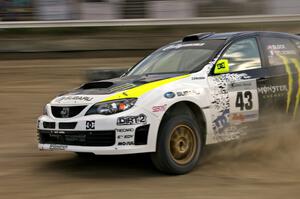 Ken Block / Alex Gelsomino drift through a left hander in their Subaru Impreza WRX STi on SS1.(1)