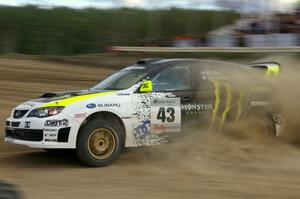 Ken Block / Alex Gelsomino drift through a left hander in their Subaru Impreza WRX STi on SS1.(2)