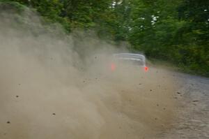 Travis Pastrana / Christian Edstrom drift their Subaru WRX STi through a fast left-hander on SS2.