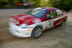 Lauchlin O'Sullivan / Karen Wagner drive their Dodge SRT-4 at speed through a fast left-hander on SS2.