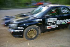 Pat Moro / Jeremy Wimpey at speed in their Subaru WRX STi through a fast sweeper on SS2.