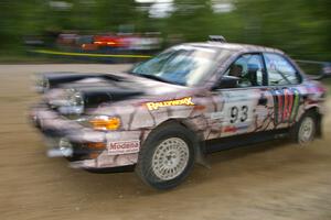 Bob Olson / Conrad Ketelsen fling their Subaru Impreza past marshals at a fast left-hander on SS2.