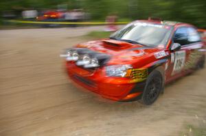 Nate Conley / Adam Kneipp at speed through a fast left-hander in their Subaru WRX STi on SS2.