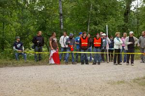 Spectators and marshals at an intersection on SS3.