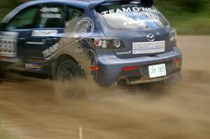 Wyatt Knox / Martin Headland at speed through a fast left-hander on SS2 in their Mazda Speed 3.