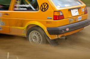 The Chad Eixenberger / Ben Slocum VW Golf sprays gravel at a fast left hander on SS2.