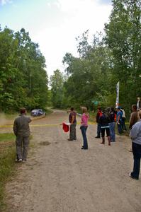 Marshalls and spectators on SS3 as the Paul Koll / Heath Nummemacher VW Golf passes by.