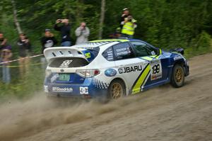 Travis Pastrana / Christian Edstrom in their Subaru WRX STi blast uphill after the spectator hairpin on SS4.