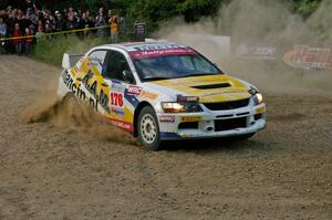 Andi Mancin / Maciej Wislawski	Mitsubishi Lancer Evo 9 at the SS4 spectator uphill hairpin.