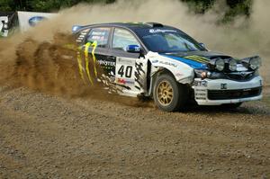 Dave Mirra / Derek Ringer prepare to head uphill at the spectator hairpin on SS4 in their Subaru WRX STi.