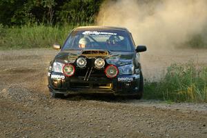 Pat Moro / Jeremy Wimpey drift their Subaru WRX STi through an uphill hairpin on SS4.