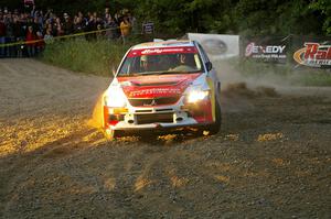 Arkadiusz Gruszka / Lukasz Wronski accelerate their Mitsubishi Lancer Evo 9 through the spectator hairpin on SS4.