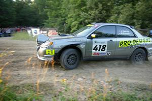 Jimmy Keeney / Missy Keeney fling their Subaru WRX STi in preparation for the uphill hairpin on SS4.