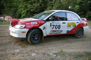 Jan Zedril / Jody Zedril take the uphill hairpin on SS4 in their Mitsubishi Lancer ES.