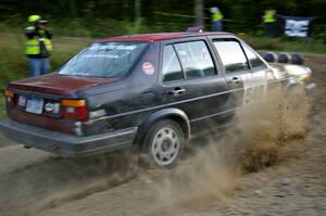 Matt Bushore / Kim DeMotte set their VW Jetta up for the uphill hairpin on SS4.