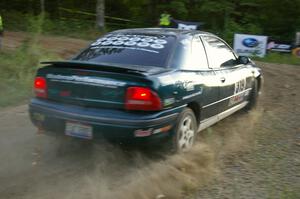 Chris Greenhouse / Don DeRose set up wide in their Plymouth Neon for a run at the uphill hairpin on SS4.