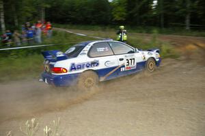 Mason Moyle / Scott Putnam set up for the uphill hairpin at the SS4 spectator point in their Subaru Impreza.