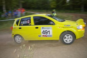 Jim Stevens / Marianne Stevens head uphill at the SS4 hairpin in their Suzuki Swift.