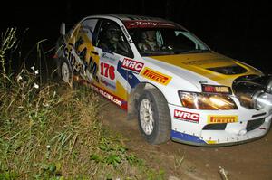 Andi Mancin / Maciej Wislawski in their Mitsubishi Lancer Evo 9 through a right-hander on SS6.