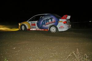 Arkadiusz Gruszka / Lukasz Wronski flog their Mitsubishi Lancer Evo 9 through the downhill right-hand hairpin on SS7.