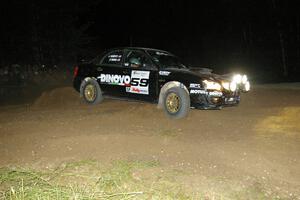 Pat Moro / Jeremy Wimpey drift wide in their Subaru WRX STi through the downhill hairpin on SS7.