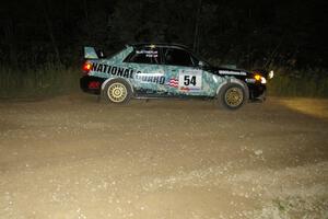 Mark Fox / Jake Blattner drift wide out of the downhill hairpin on SS7 in their Subaru WRX STi.