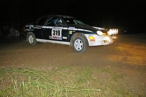 Chris Greenhouse / Don DeRose go a bit wide in their Plymouth Neon at the downhill hairpin on SS7.