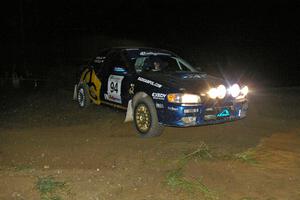 Piotr Fetela / Mariusz Malik slide wide at the downhil hairpin on SS7 in their Subaru Impreza.