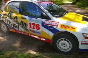 The Andi Mancin / Maciej Wislawski Mitsubishi Lancer Evo 9 through a right-hander on SS8.