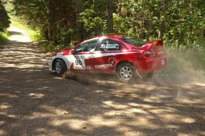 Lauchlin O'Sullivan / Karen Wagner drift their Dodge SRT-4 through a 90-right on SS8.