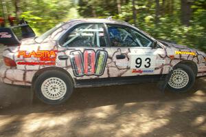 The Bob Olson / Conrad Ketelsen Subaru Impreza rockets out of a right-hander on SS8.