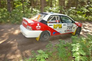 Jan Zedril / Jody Zedril come out of a 90-right on SS8 in their Mitsubishi Lancer ES.