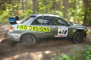 Jimmy Keeney / Missy Keeney power through a 90-right on SS8 in their Subaru WRX STi.