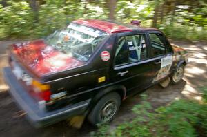 Matt Bushore / Kim DeMotte blast out of a 90-right on SS8 in their VW Jetta.