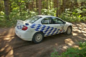 Zach Babcock / Jack Penley blast their Dodge SRT-4 out of a right-hander on SS8.