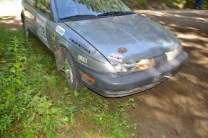 Dan Adamson / Matt Nichols apex a corner on SS8 a little more than the average car in their Saturn SL2.