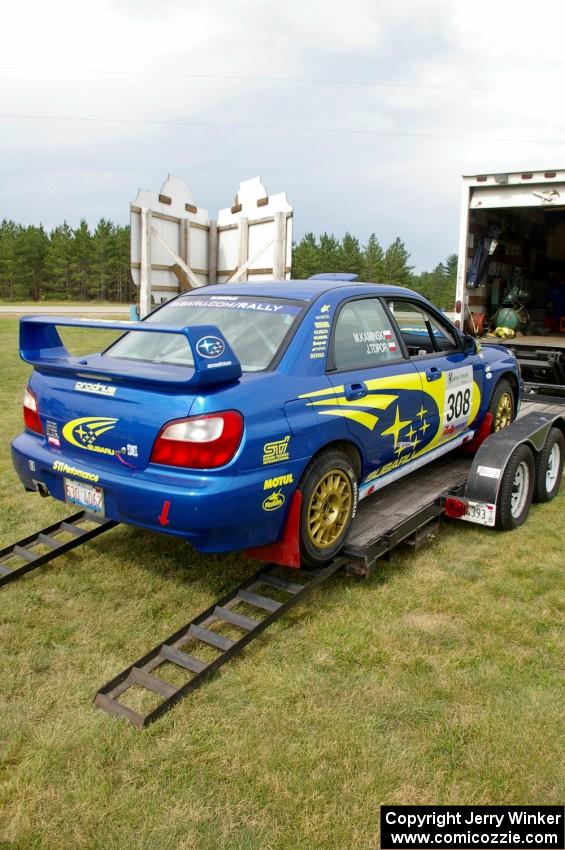 Janusz Topor / Michal Kaminski unload their freshly-prepped open class Subaru WRX STi off the trailer.