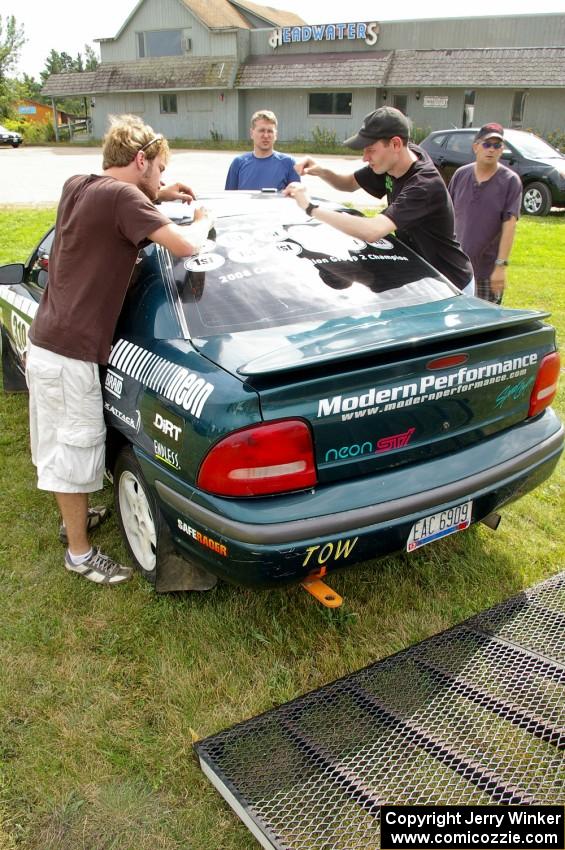 The Chris Greenhouse / Don DeRose Plymouth Neon gets more vinyl stickers added to the back window prior to the practice stage.