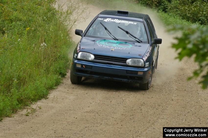 Paul Koll / Heath Nunnemacher take a fast right-hander on the practice stage in their VW Golf.