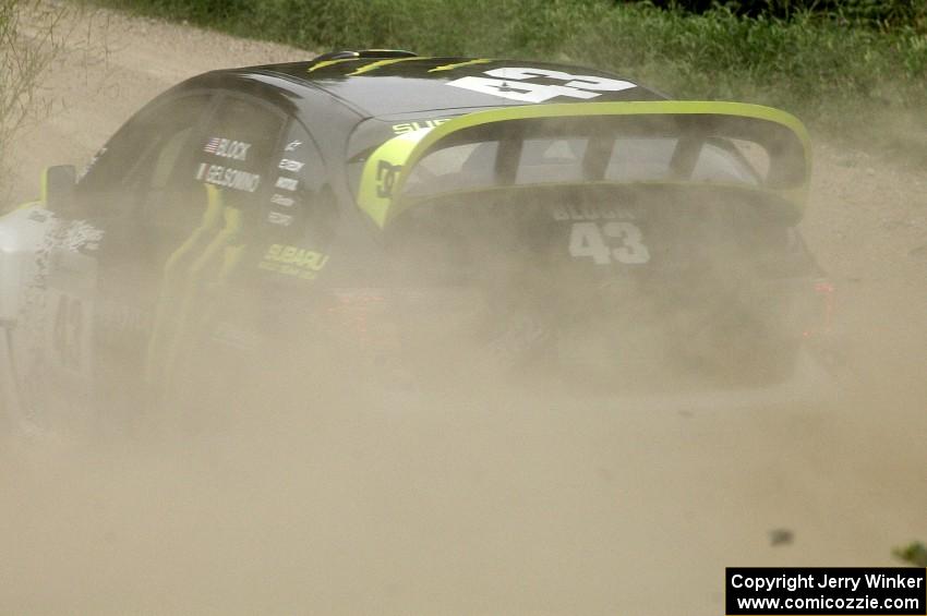 The Ken Block / Alex Gelsomino Subaru Impreza WRX STi spays gravel on the practice stage.