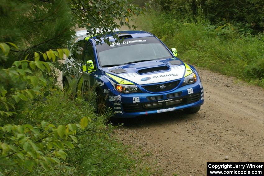 Travis Pastrana / Christian Edstrom set their Subaru WRX STi up for a left-hander on the practice stage.