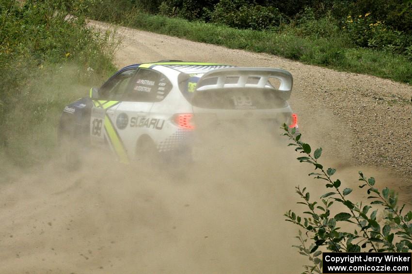 Travis Pastrana / Christian Edstrom drift their Subaru WRX STi through a left-hander on the practice stage.